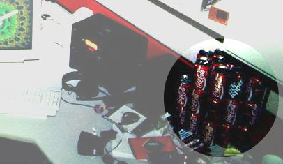 pic of workstation with many soda cans